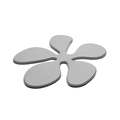 Glasunderlägg i silikon i formen av en grå blomma från KG design
